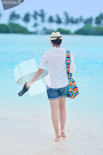 Image of beautiful gril on beach have fun