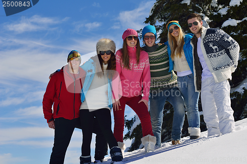 Image of friends have fun at winter on fresh snow
