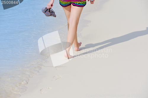 Image of beautiful gril on beach have fun