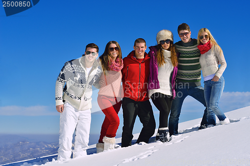 Image of friends have fun at winter on fresh snow