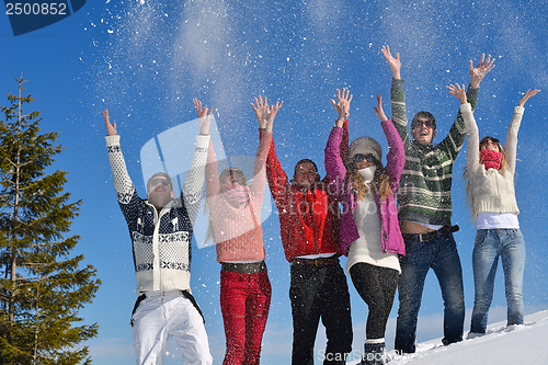 Image of friends have fun at winter on fresh snow