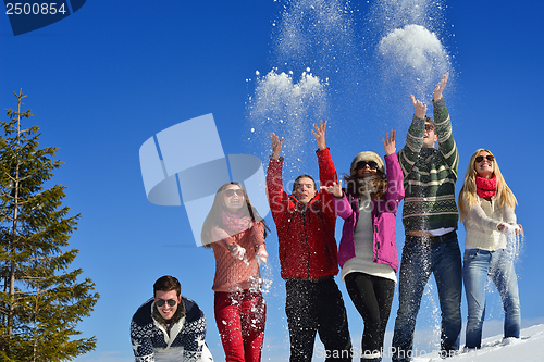 Image of friends have fun at winter on fresh snow