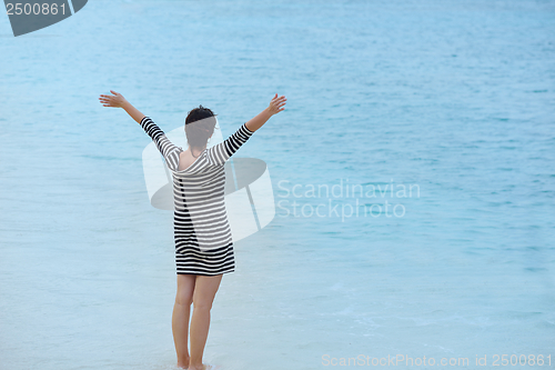 Image of beautiful gril on beach have fun