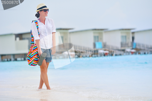 Image of beautiful gril on beach have fun