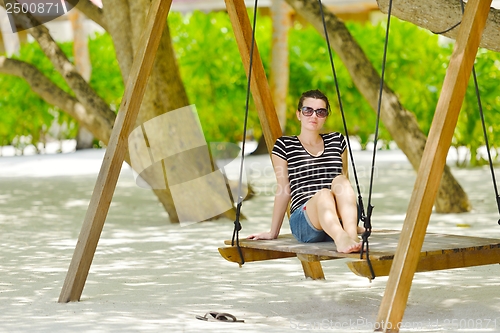 Image of beautiful gril on beach have fun
