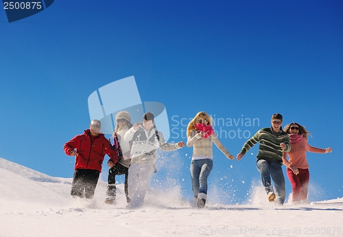 Image of friends have fun at winter on fresh snow