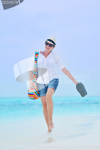 Image of beautiful gril on beach have fun