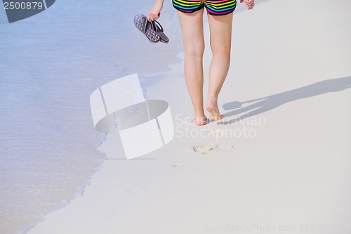 Image of beautiful gril on beach have fun