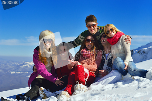 Image of friends have fun at winter on fresh snow