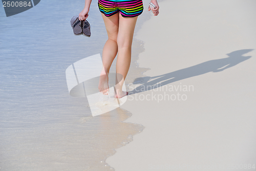 Image of beautiful gril on beach have fun