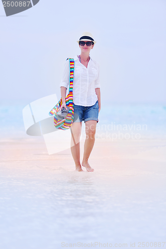 Image of beautiful gril on beach have fun