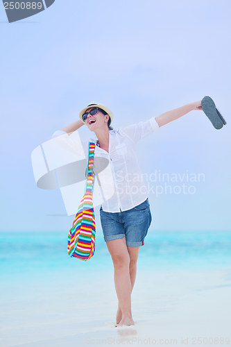 Image of beautiful gril on beach have fun