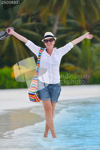 Image of beautiful gril on beach have fun