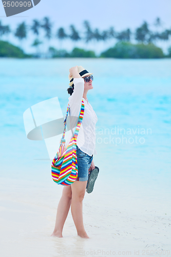 Image of beautiful gril on beach have fun