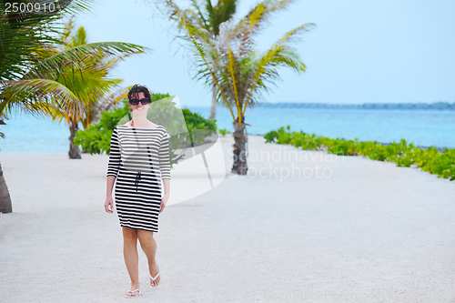 Image of beautiful gril on beach have fun