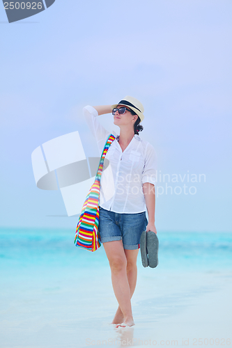 Image of beautiful gril on beach have fun