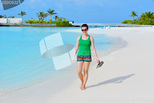 Image of beautiful gril on beach have fun