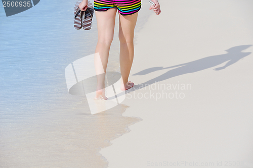Image of beautiful gril on beach have fun