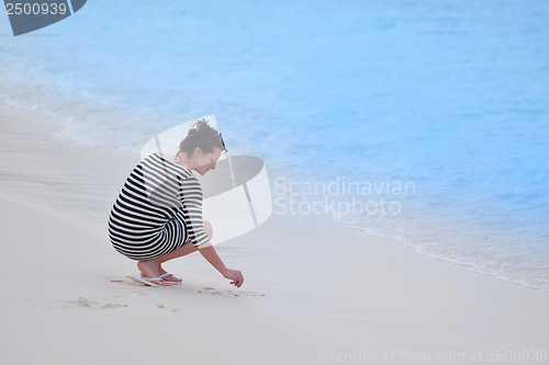 Image of beautiful gril on beach have fun