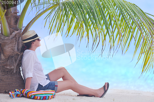 Image of beautiful gril on beach have fun