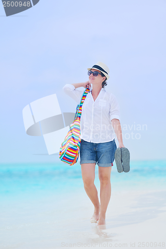 Image of beautiful gril on beach have fun