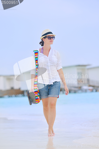 Image of beautiful gril on beach have fun