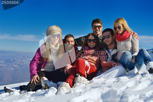 Image of friends have fun at winter on fresh snow