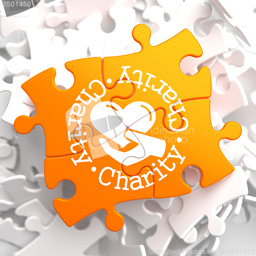 Image of Charity Concept on Orange Puzzle.
