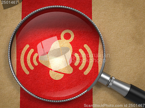 Image of Magnifying Glass with Ringing Bell Icon .