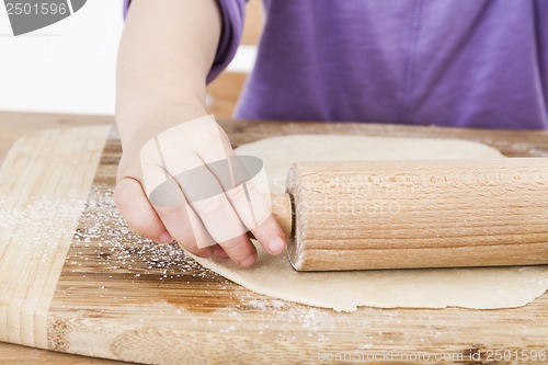 Image of child baking pie