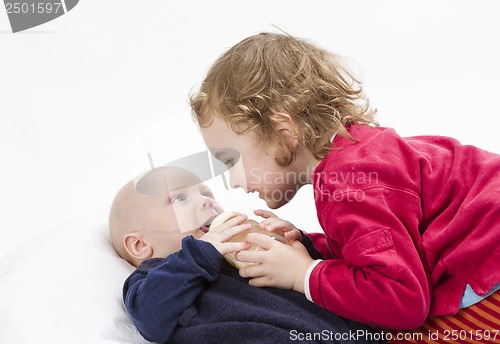 Image of baby boy with older sister