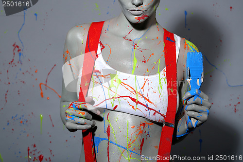 Image of Female House Painter Splattered with Latex Paint