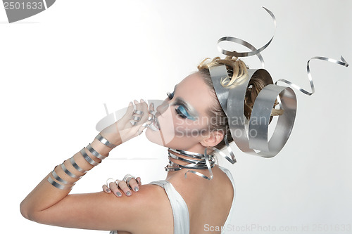 Image of Image of a Woman Wearing Styled Metal Work 