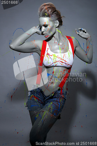 Image of Female House Painter Splattered with Latex Paint