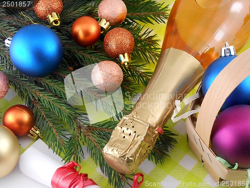 Image of champagne bottle and christmas baubles, Merry Christmas and Happy New Year