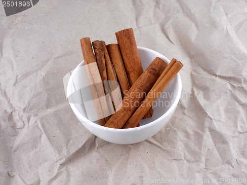 Image of Cinnamon stick set on old retro paper