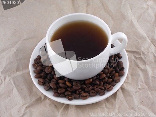 Image of cup of coffee and beans on old vintage retro paper