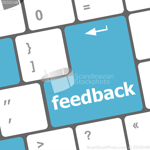 Image of Keyboard with single blue button showing the word feedback