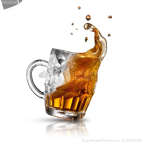 Image of Beer splash in glass isolated on white