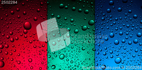 Image of water drops on red, green and blue backgrounds