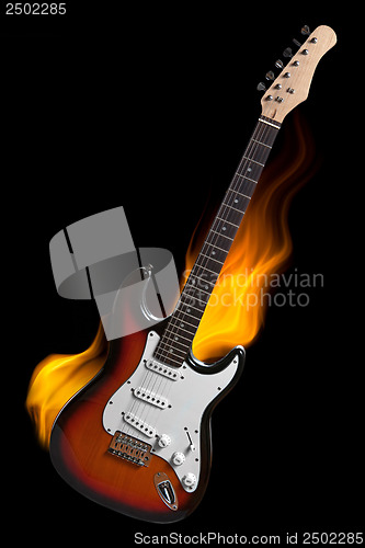 Image of electric guitar on fire isolated on black