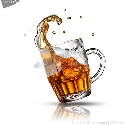 Image of Beer splash in glass isolated on white