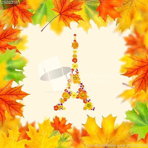 Image of eiffel tower of flowers with autumn leaves frame