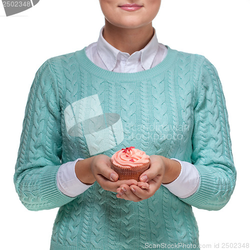 Image of Woman holding a pink cupcake on white