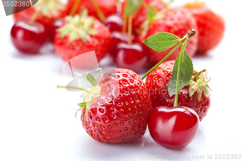 Image of Red cherry with strawberry on white