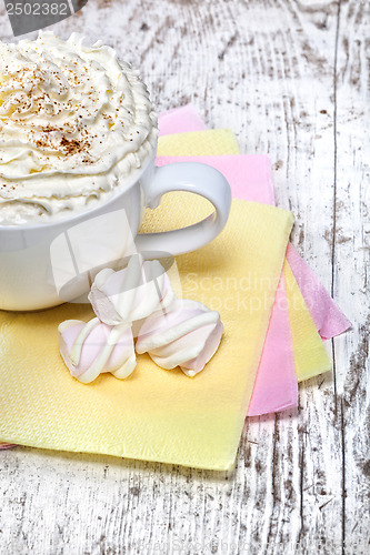 Image of hot chocolate with marshmallows and cream on wooden background