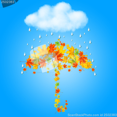 Image of umbrella from autumn leaves under cloud and rain