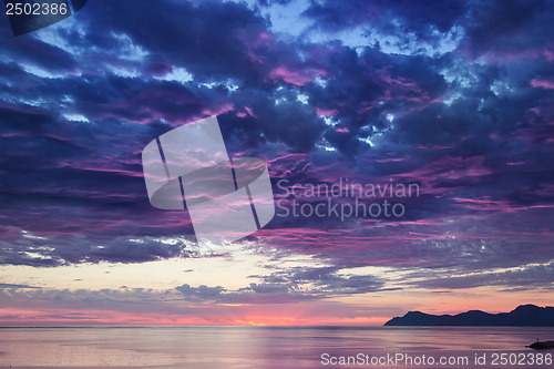 Image of landscape with sea and mountains on sunrise