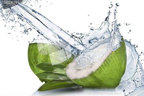 Image of Green coconut with water splash isolated on white