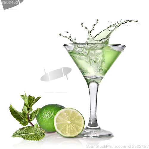 Image of Green alcohol cocktail with splash, lime and mint isolated on wh